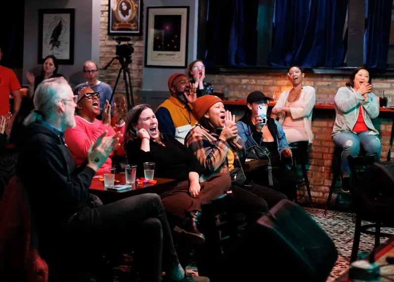 The audience packed in, laughing and applauding